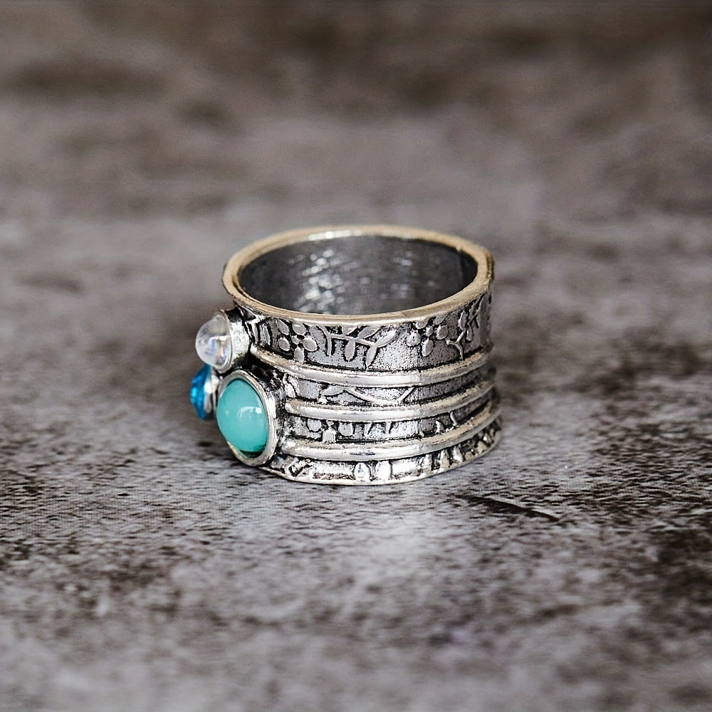 Zilveren spinner ring met blauwe edelstenen