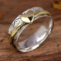 Zilveren gouden draairing met hart