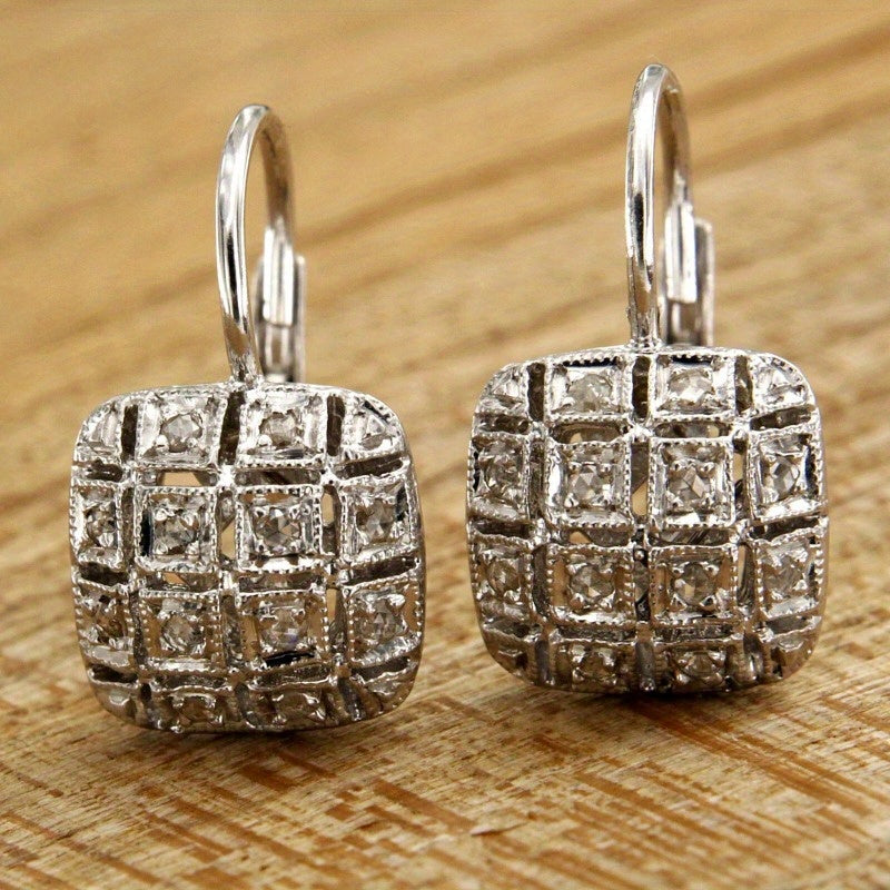 Zilveren vintage oorbellen met geometrisch open vlak en zirkonia