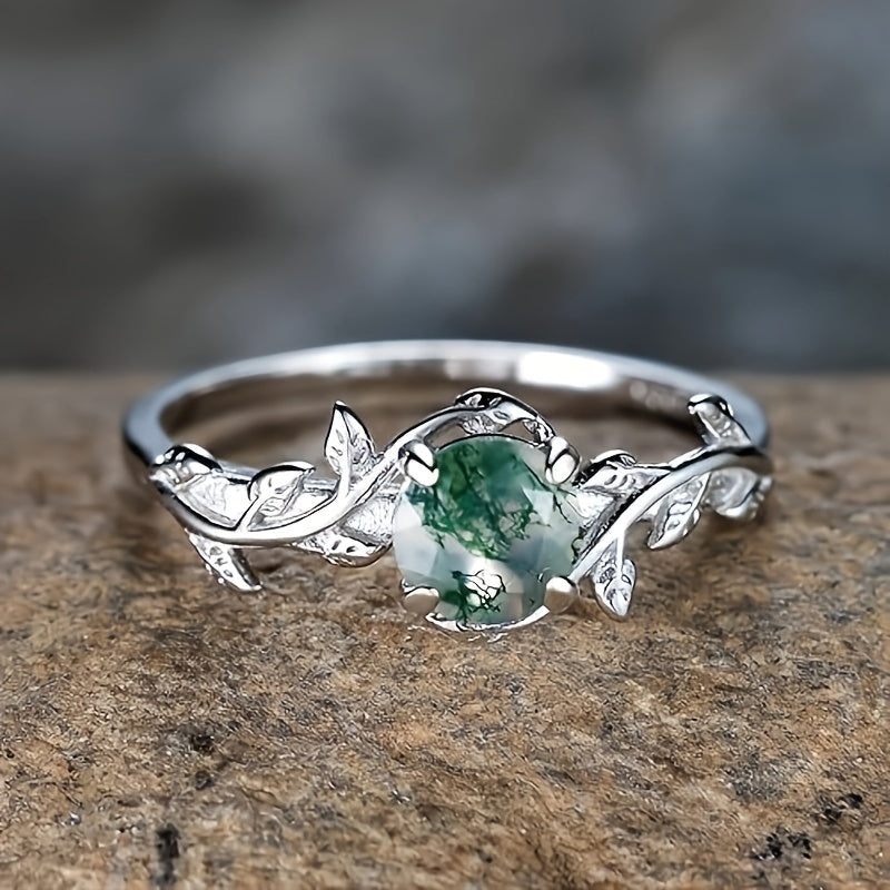 Zilveren ring met mosagaat en bladmotief