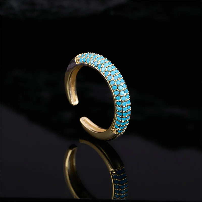 Gouden verstelbare ring met turquoise kralen