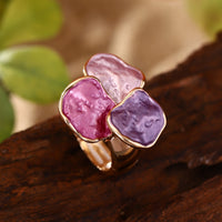 Roségouden ring met roze en paarse edelstenen