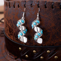 Zilveren oorbellen met spiraal en turquoise