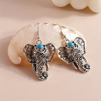 Zilveren boho olifant oorbellen met turquoise