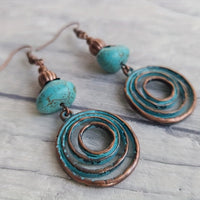 Bohemian oorbellen met roségoud spiraal en turquoise