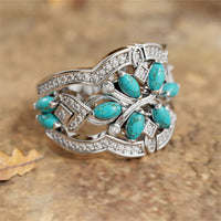 Zilveren ring met turquoise blaadjes en zirkonia