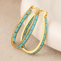 Gouden ovale oorbellen met turquoise