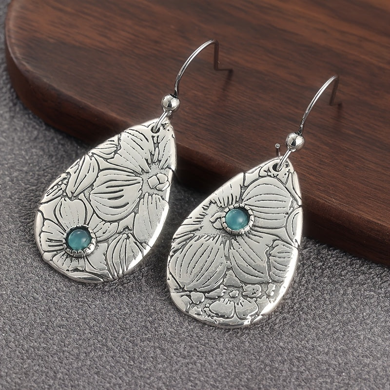 Zilveren oorbellen met gegraveerde bloem en turquoise