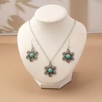 Zilveren bloemenset ketting en oorbellen met turquoise