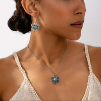 Zilveren bloemenset ketting en oorbellen met turquoise
