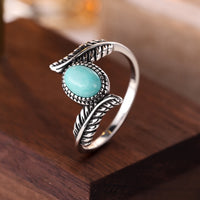 Zilveren ring met veer en turquoise