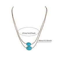 Bohemian ketting met turkooizen hanger en zilveren kwastjes