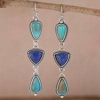 Zilveren oorbellen met turquoise en lapis druppels