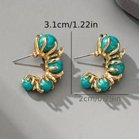 Gouden ring met ovale turquoise edelsteen