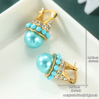 Vintage gouden oorbellen met turquoise parel