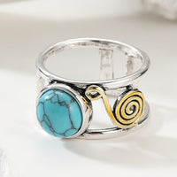 Tweekleurige bohemian ring met ronde turkooizen steen