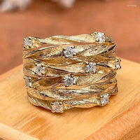 Gouden ring met gevlochten band en zirkonia