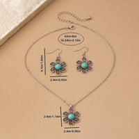 Zilveren bloemenset ketting en oorbellen met turquoise