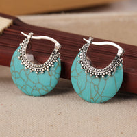Zilveren bohemian oorbellen met turquoise schijf