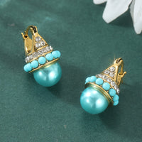Vintage gouden oorbellen met turquoise parel