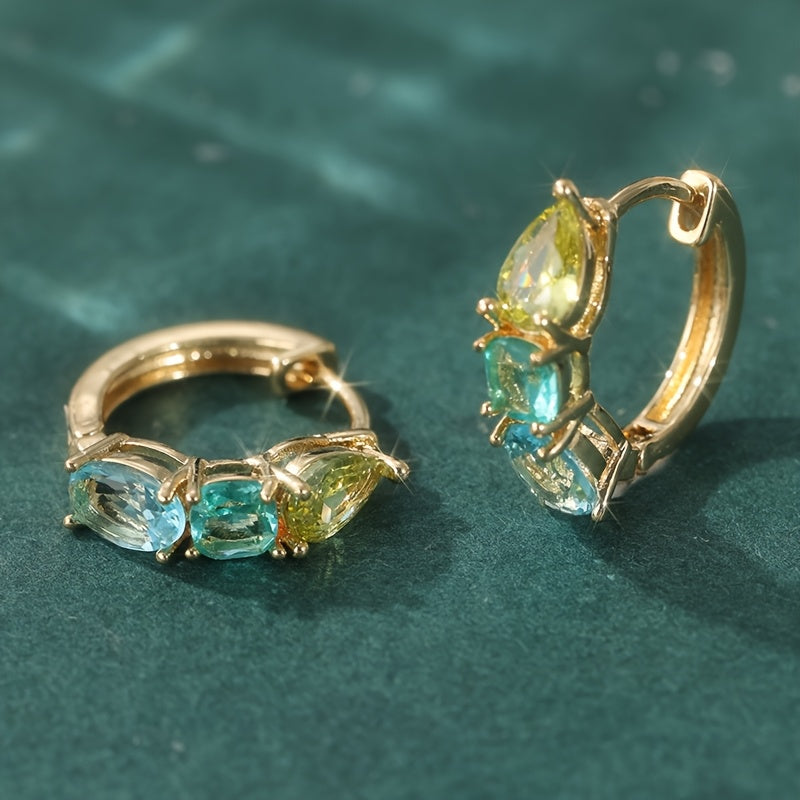 Gouden oorbellen met gele en blauwgroene edelstenen