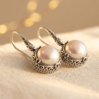 Zilveren vintage oorbellen met roze parel