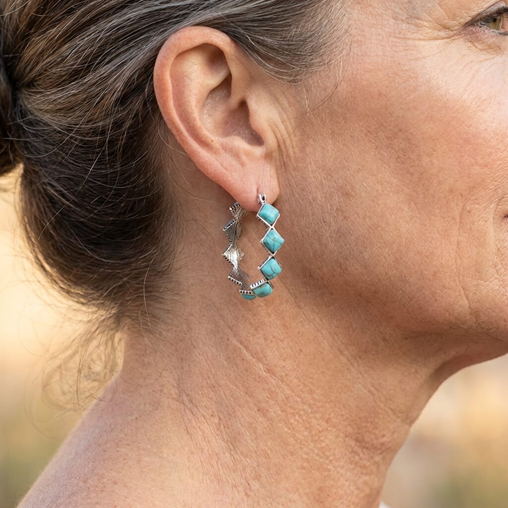 Zilveren oorbellen met turquoise ruitstenen