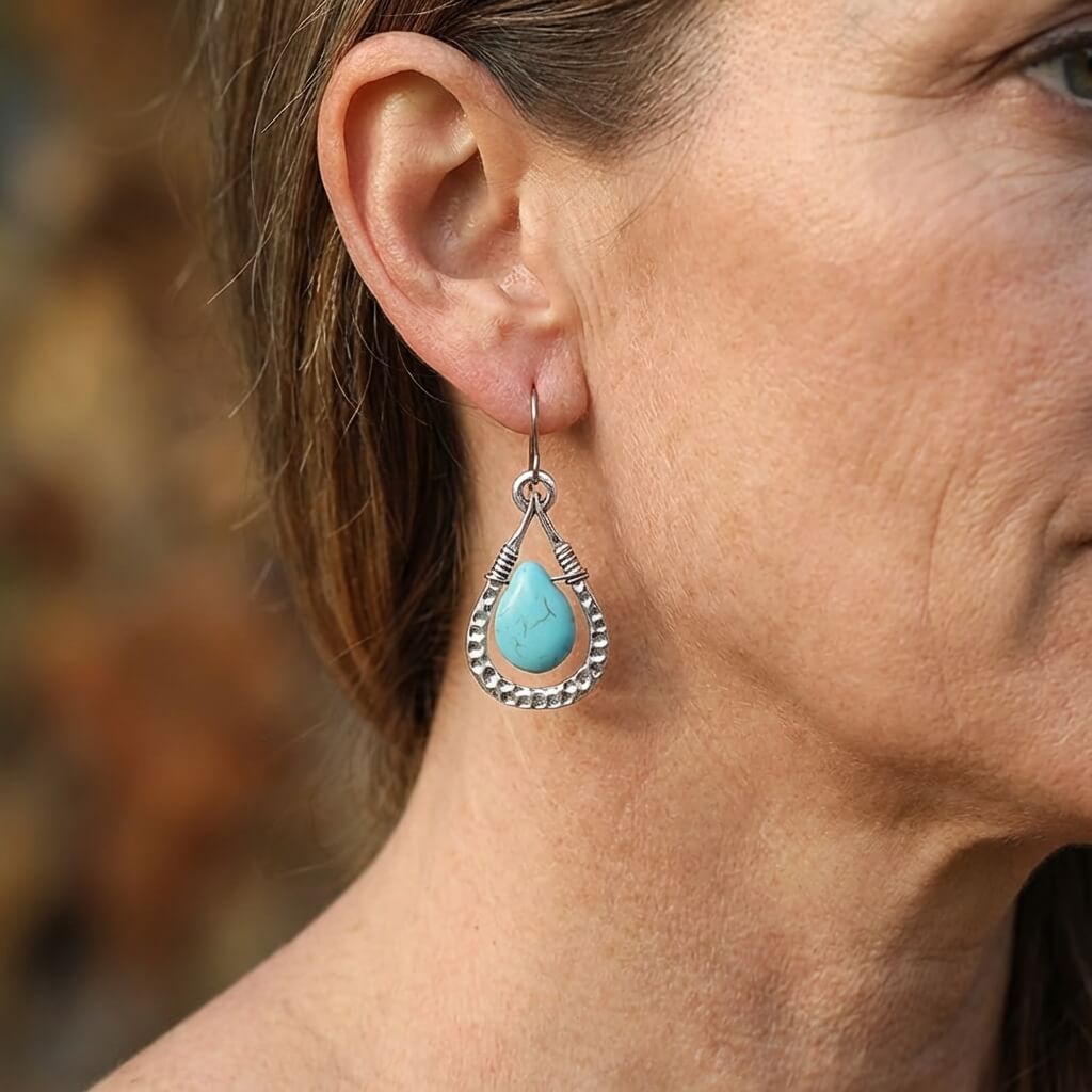 Zilveren oorbellen met wire-wrapped turquoise druppel