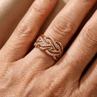 Gouden gevlochten ring met zirkonia