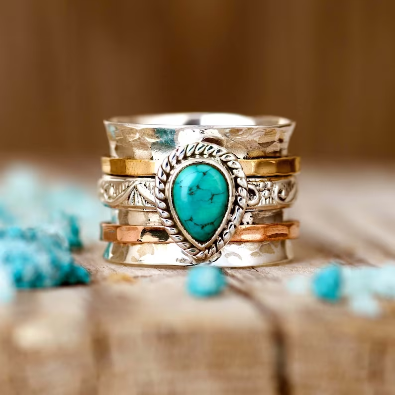 Zilveren spinner ring met turquoise edelsteen