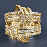Gouden gekruiste ring met zirkonia