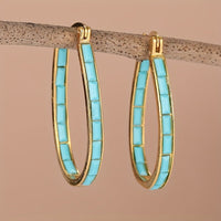 Gouden ovale oorbellen met turquoise