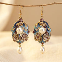Gouden vintage oorbellen met blauw emaille en parel