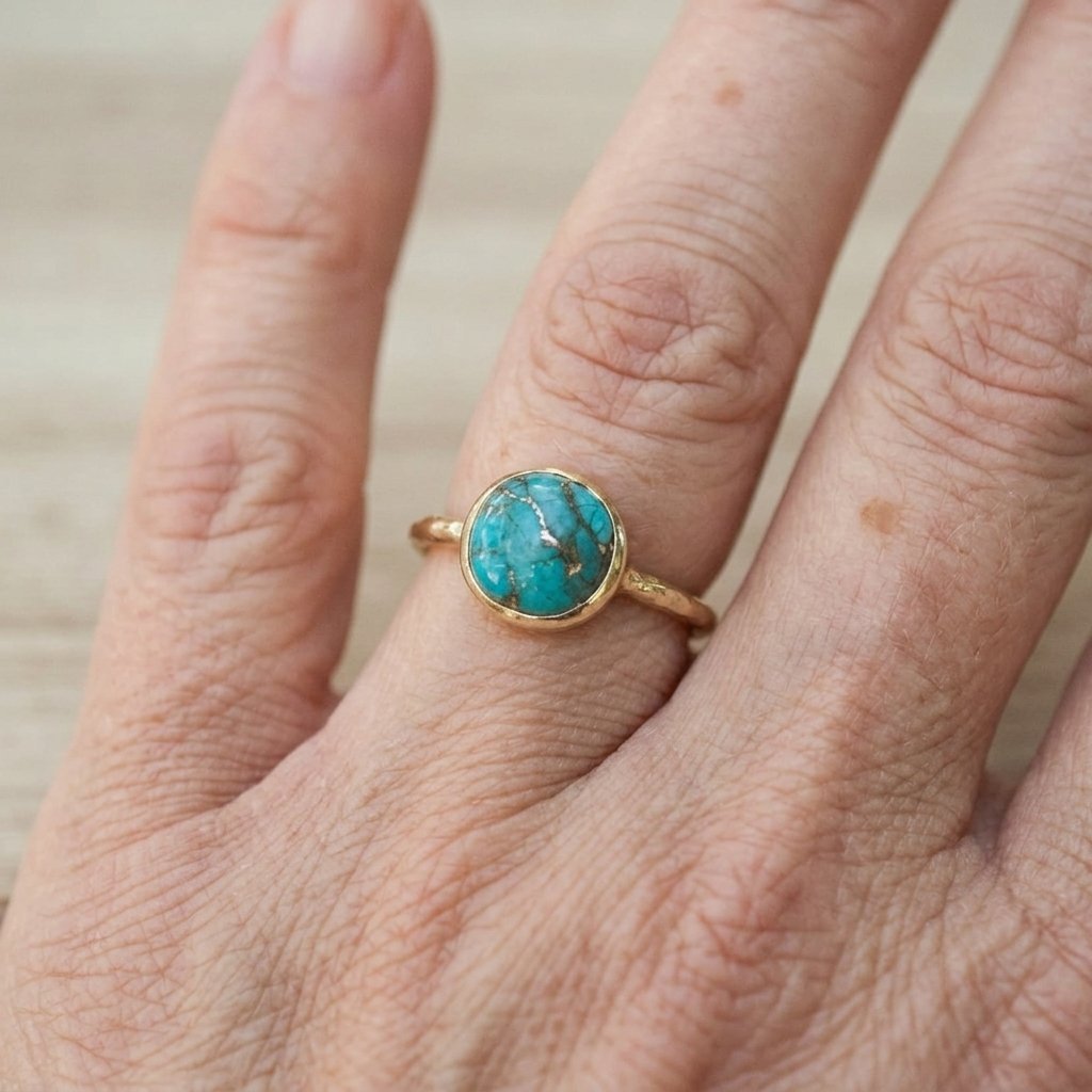 Gouden minimalistische ring met rond turkoois